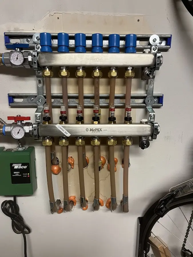 Plumber performing Water Heater Repair at a residential property in Munford